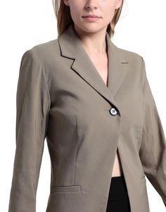 Elevate your wardrobe with our sophisticated and versatile Blazer. Crafted from a luxurious blend of 76% Viscose, 21% Polyamide, and 3% Elastane, this crepe blazer is designed to flatter your figure with precision-cut darts and a sleek, solid color finish. The classic lapel collar and single-breasted, one-button closure exude timeless elegance, while the addition of shoulder pads adds structure and polish to the silhouette. With its fully lined interior and multipockets, this blazer is as functional as it is fashionable, allowing you to carry all your essentials with ease. The stretch fabric ensures a comfortable fit and freedom of movement, making it perfect for all-day wear. At a length of 28.08 inches, this blazer strikes the perfect balance between professional and stylish, effortlessl Fitted Button-up Blazer Dress For Business Casual, Single-breasted Collared Outerwear, Classic Button-up Blazer For Work, Semi-formal Solid Color Office Lady Blazer, Semi-formal Solid Color Office Blazer, Solid Semi-formal Blazer For Office, Semi-formal Office Blazer, Office Blazer Dress Single Breasted In Solid Color, Office Solid Single Breasted Blazer Dress