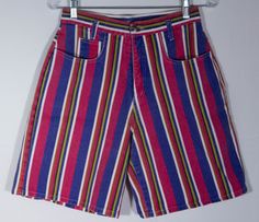 We ADORE these colorful, bright and bold print striped shorts! Here's a pair of striking, made in USA 80s collectible "Enchant" label jean shorts with a cute, fun style. The denim cotton print of stripes in vibrant colors are stunning with a great bare back pattern to the cut. These gem shorts are a rare find and definitely standout in a crowd. These cotton denim shorts really have that classic 80s look and cut and they are in really great overall condition with more minor signs of wear or use. Multicolor Bermuda Bottoms For Spring, Retro Striped Short Bottoms, Vintage Multicolor Short Length Bottoms, Retro Striped Short-length Bottoms, Vintage Multicolor Short Bottoms, Retro Multicolor Beach Shorts, Retro Multicolor Shorts, Retro High Waist Multicolor Shorts, Retro Multicolor Cotton Shorts