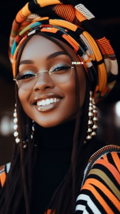 an african woman wearing glasses and a head scarf with beads on her head, smiling at the camera