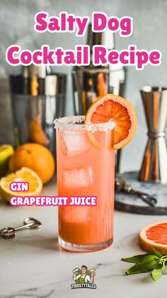 a cocktail with grapefruit and oranges on the side