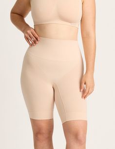 Soft wide waistband to flatteringly smooth and support Built in supportive side structure to smooth silhouette along hips & thighs Dual-function shorts: providing anti-thigh chafing protection and gentle smoothing support Long 8" inseam to sit comfortably lower on the leg Enhanced hem at leg opening to secure in place High rise style that sits comfortably at your waist Designed to move with you - forget about sweaty, synthetic fabrics and suffocating fits Crafted from our signature organically grown bamboo blend, our premium-knit fabric combines strength and softness for supportive, unrestricted comfort Note: This is our shapewear version of the Seamfree Undershort 6". With a longer inseam and built in structure, they are perfect for providing support and shaping under your outfit. It offe Shapewear Shorts With Full Coverage, Full Coverage Smoothing Shapewear Shorts, Compressive Supportive Short Shapewear, Supportive Mid-thigh Bottoms With Built-in Shorts, Supportive Stretch Shapewear Short Length, Supportive Stretch Shapewear With Built-in Shorts, Solid Smoothing Shaping Activewear, Compressive Mid-thigh Length Shapewear With Soft Touch, Solid Compressive Full Coverage Shorts