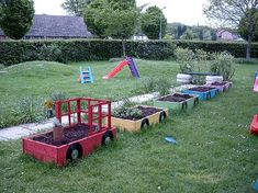 the children's play area is filled with plants and toys