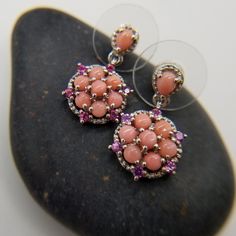 Oregon, Peach Opal, With Orissa Rhodolite Garnet. Earrings. Platinum Over Sterling Silver. Oregon, Peach Opal (1) Ct. (43) Mm. (7) Ct. (2.75) Mm. Orissa Rhodolite Garnet Rounds (1.75) Mm. Prong Set. Dangle. Peachy, Tones Salmon,Sorbet. Orissa, Rhodolite Garnet. Rosy Red Pink's. Hints Of Purplish Pink's. Great Combination Of Gemstones. Beautiful, Celestial. New. Gift Box Included. Elegant Coral Sterling Silver Jewelry, Formal Pink Earrings With Gemstone Accents, Elegant Orange Earrings With Natural Stones, Pink Sterling Silver Earrings With Gemstone Accents, Peach Round Gemstone Jewelry, Round Peach Gemstone Jewelry, Pink Drop Earrings With Gemstone Accents, Formal Coral Jewelry With Matching Earrings, Coral Jewelry Set With Matching Earrings For Formal Events