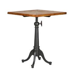 an old fashioned wooden table with black metal legs and a square top, on a white background