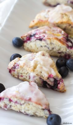 cherry cheesecake bars on a cutting board with cherries