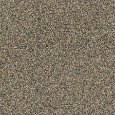 a close up view of a carpet textured with dark brown and light gray colors