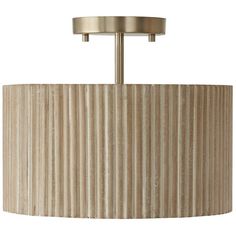 a light fixture with a beige pleated shade on the bottom and two lights above it