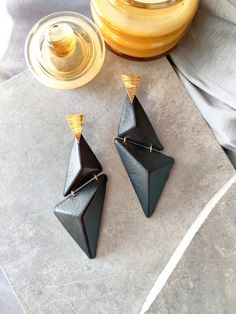 These architectural earrings are inspired by mid-century modern architecture. Their mismatched dangle geometry makes them one-of-a-kind statement earrings. Upcycled Black Leather Earring, Lightweight Mismatched Oversized Earrings. Architectural Earrings, Architectural Jewelry, Oversized Earrings, Long Earring, Leather Earring, Icing On The Cake, Bold Earrings, Geometric Earrings, Leather Earrings