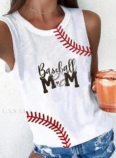 a woman holding a drink and wearing a baseball mom shirt