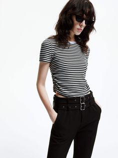 MO&Co. Women's Side Pleated Cropped T-shirt This T-shirt is made from comfortable cotton blend fabric that offers a flattering and short cut. The side pleated details and classic stripes add a touch of sophistication, making it a perfect match for high-waisted skirts and pants. Features : - Cropped, slim ribbed knit fit- Round neck, double side pleats- Classic black and white stripes Code: MBD1TEET09The back length of size S is 46.8cmMATERIALS & CARE Material: 96.4% Cotton 3.6% SpandexREMINDER: Waisted Skirts, Black And White Stripes, Short Cut, Cropped T Shirt, Cotton Blend Fabric, Crop Tshirt, Color Stripes, Perfect Match, Classic Black