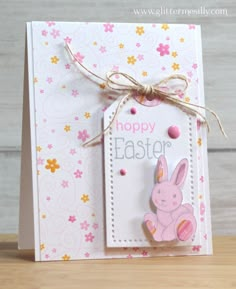 an easter card with a pink bunny on the front and happy easter tag on the back