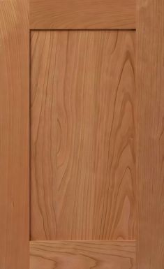 a close up view of the wood grains on this cabinet door, which has been painted light brown