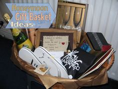 a basket filled with lots of different types of wine and other items on top of a table