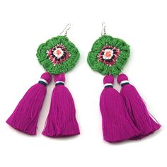 two tasseled earrings with pink and green beads on them, one has a flower in the center