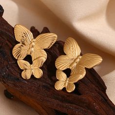 These Large Gold Butterfly Earrings make a bold statement with their stunning design. Perfect for adding a touch of elegance and sophistication to any outfit. These earrings will surely catch attention and elevate any look. DETAILS & SIZE Sold as a pair Finish: 18K gold plate Material: Stainless Steel Measurements: 1.6"x1.2" Weight: 12.6 grams Comes with friction earring backs Waterproof, tarnish-resistant, and nickel free Shop Earrings to curate your ear stack! Luxury Gold-plated Earrings, Butterfly-shaped Yellow Gold Earrings For Anniversary, Tarnish-resistant Gold Clip-on Earrings, Yellow Gold Butterfly Earrings For Anniversary, Gold Clip-on Bridal Drop Earrings, Butterfly-shaped Yellow Gold Anniversary Earrings, Luxury Yellow Gold Butterfly Earrings, Yellow Gold Plated Bridal Earrings, Gold Tarnish Resistant Earrings For Wedding