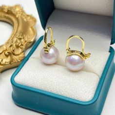 Discover the essence of modern elegance with our Freshwater Pearl Bucket-Shaped Earrings. Each piece features a captivating 11-12mm round freshwater pearl of AAA quality, exuding classic sophistication. Meticulously crafted in 925 sterling silver, with an option for 18k gold vermeil, these earrings showcase a sleek, contemporary design. The distinctive bucket shape combines a minimalist approach with the timeless allure of pearls, creating a versatile accessory ideal for any ensemble. A perfect Elegant High Luster Pearl Earrings Gift, Luxury Akoya Pearl Earrings With High Luster, Luxury Round Pearl Drop Earrings, Luxury Pearl Charm Earrings As Gift, Formal Round Pearl Earrings With Lever Back Ear Wires, Formal Round Pearl Earrings With Lever Back, Luxury High Luster Pearl White Pearl Earrings, Gift Akoya Pearl Earrings With High Luster, Modern Round Pearl Earrings With Pearl Charm