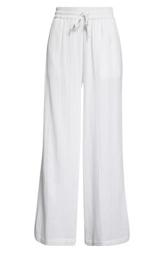 Cut from soft cotton gauze, these cover-up pants feature handy pockets and an easy-fitting drawstring waist. 29" inseam; 27 1/2" leg opening; 13 1/2" front rise; 18" back rise (size Medium) Drawstring waist Side-seam pockets 100% cotton Machine wash, line dry Imported Chic Cotton Beach Pants, Chic Cotton Pants For Beach Season, White Breezy Loungewear Bottoms, Breezy White Loungewear Bottoms, Relaxed Cotton Pants For Beach Season, Relaxed Fit Cotton Pants For Beach Season, Cotton Beachwear Pants, Beach Wide Leg Cotton Pants, Chic Cotton Wide Leg Pants For Beach Season