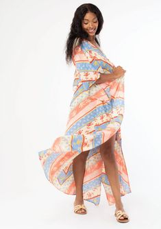 A versatile bohemian beach duster kimono in a bold red and indigo blue floral chevron stripe. FINAL SALE Floral chevron stripe Crinkle gauze Relaxed, flowy fit Kimono sleeves Maxi length Billowy silhouette Long & lightweight Tassel tie front closure Just in time for Summer, this lightweight beach cover-up features half-length kimono sleeves, a billowy silhouette, and an adjustable tassel tie waist. We love to style it open over cut-off shorts or style it closed over a bathing suit for a relaxing Striped Kaftan For Summer Beach Cover-up, Red Bohemian Spring Cover-up, Casual Summer Beach Duster, Bohemian Spring Beach Duster Cover-up, Long Patterned Kimono For The Beach, Summer Beach Long Duster, Long Summer Beach Duster, Bohemian Long Duster For Vacation, Long Duster For Beach In Summer