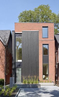 a brick house with large windows on the side