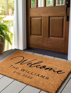 a welcome mat is on the front porch