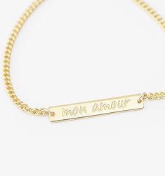 Who says subtle can't be powerful? The small bar bracelet keeps your reminder short and sweet on this polished piece of minimal thoughtfulness. Personalized Minimalist Rectangular Name Bracelet, Gold Personalized Name Bracelet Rectangular Shape, Gold Nameplate Chain Bracelet With Custom Name, Personalized Gold Rectangular Name Bracelet, Gold Rectangular Jewelry With Engraved Text, Personalized Nameplate Gold Bracelet, Personalized Yellow Gold Rectangular Name Bracelet, Personalized Rectangular Yellow Gold Name Bracelet, Minimalist Rectangular Name Bracelet For Anniversary