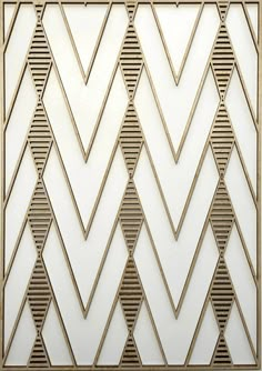 a white wall with gold geometric designs on it