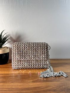 Dazzling nights call for an exquisite companion. This beaded evening bag adds the perfect touch of glamour to your ensemble. Dimension: Width: 18cm Height: 13cm Depth: 6cm The bag comes with two detachable handles. Feel free to contact me for any questions. Glamorous Sparkling Shoulder Bag For Party, Luxury Sparkling Evening Bag For Party, Glamorous Sparkling Clutch For Events, Glamorous Evening Shoulder Bag With Pearl Handle, Glamorous Party Shoulder Bag, Sparkling Rectangular Evening Bag, Sparkling Rectangular Evening Bags, Glamorous Beaded Bag For Events, Glamorous Beaded Bags For Events