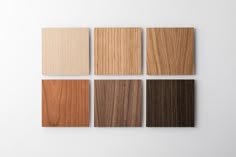 four different types of wood on a white wall