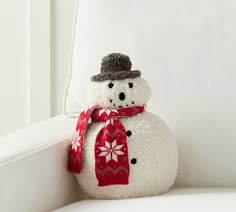 a snowman sitting on top of a white couch