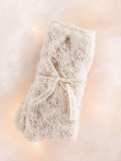 A luxuriously soft, lounge worthy wear - these socks from Barefoot Dreams are the perfect to wear this chilly season. This cozy go-to features a printed take on the look, which we love for a trending look. Cozy Soft Beige Socks, Cozy Super Soft Cream Socks, Warm Cozy Cream Socks, Cozy Soft Socks For Loungewear, Cozy Soft Socks For Gifts, Cozy Soft Knit Socks For Loungewear, Cozy Soft Cream Socks, Cozy Cream Soft Socks, Cozy Soft Knit Loungewear Socks