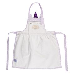 a white apron with purple polka dots and a unicorn face on the front, while it is