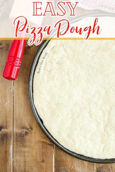 an easy pizza dough recipe in a pan on a wooden table with the title overlay