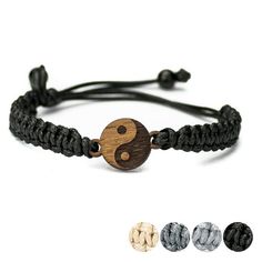 a bracelet with two beads and a wooden yin sign on the front, three different colors