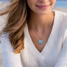 Immerse yourself in a world of playful refinement with our Into the Blue Necklace—a truly lovely adornment that effortlessly captures the mesmerizing essence of the wonders of the seas. This necklace isn't just jewelry; it's a wearable masterpiece, designed to evoke the allure of ocean depths and the enchanting mysteries found beneath the waves. Elevate your style with this captivating piece, a harmonious blend of playfulness and refined elegance. Dive into the world of ocean-inspired fashion an Blue Clavicle Chain Jewelry As Gift, Blue Clavicle Chain Jewelry Gift, Blue Clavicle Chain Jewelry For Gifts, Elegant Blue Jewelry For Beach, Turquoise Round Pendant Jewelry As Gift, Turquoise Round Pendant Jewelry Gift, Adjustable Blue Birthstone Jewelry, Personalized Round Turquoise Jewelry, Personalized Light Blue Jewelry For Gift