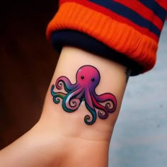 an octopus tattoo on the wrist