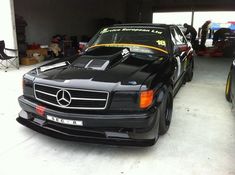 a mercedes benz is parked in a garage