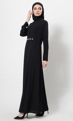 Featuring a beautiful modest wear flared asymmetrical abaya dress in nida fabirc adorned with crystal embellished motifs around the waist and pleated detailing on the upper bodice. It has flared bottom skirt, zipper closure placket at the back and pckets on the sides. Its a trendy and classic ensembl perfect to be worn for evening ocassions.FIT : Relaxed fit.COMPOSITION : Nida.CARE : Dry clean only. Elegant Long Dress Abaya For Eid, Long Sleeve Abaya With Modesty Panel For Fall, Fall Long Sleeve Abaya With Modesty Panel, Elegant Long Sleeve Maxi Dress For Eid, Modest Abaya With Modesty Panel For Spring, Spring Modest Abaya With Modesty Panel, Spring Abaya With Modesty Panel, Fitted Black Abaya For Eid, Long Sleeve Modest Abaya With Modesty Panel