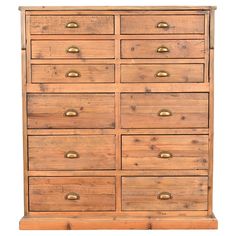 a wooden dresser with many drawers and brass knobs on the top, against a white background