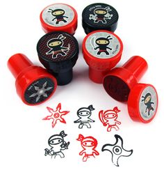 some red and black rubber stamps with stickers on them