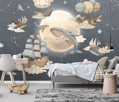 a child's bedroom with a wall mural depicting an ocean scene