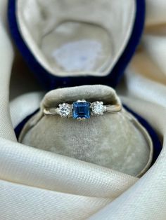 Antique C.1920 Sapphire and Diamond 3 Stone Ring in 18ct Yellow Gold & Platinum  the sweetest sapphire stone in the middle of two lovely diamonds!  The item comes without the box in the photos but will be presented in a gembank1973 gift box   Measurements: Weight 3.07g, size UK O / US 71/2, head of ring 11mm x 4mm, height off finger 4mm Materials: 18ct Yellow Gold, platinum, sapphire and diamond    Hallmarks: stamped 18ct Condition : The overall condition is very good office use: SOD2 Sapphire Diamond Ring With Rose Cut Diamonds For Gift, Emerald Cut Sapphire Ring With Three Stones, Emerald Cut Sapphire And Diamond Three Stone Ring, Heirloom White Gold Diamond Ring With Birthstone, Timeless Diamond Sapphire Birthstone Ring, Timeless Diamond Sapphire Ring With Birthstone, Timeless Sapphire Diamond Ring Birthstone, Timeless Sapphire Diamond Birthstone Ring, Vintage Diamond Rings With Birthstone