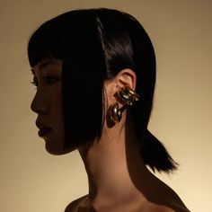 These ear cuffs are the best accessory to elevate any casual look and give you a bold, edgy style. Pair them up with our best-selling Bagel Hoops to create the perfect ear stack. Made from 18k Gold and Rhodium Plated Stainless Steel. 18k Gold Plated and Rhodium Plated Stainless Steel Tarnish Resistant. Hypoallergenic and Non-reactive. Water Resistant. Gold Plated Ear Cuff For Party, Chic Gold Single Ear Cuff, Gold Plated Single Ear Cuff For Party, Yellow Gold Single Ear Cuff In Metal, Chic Gold Single Cartilage Earring, Chic Metal Ear Cuff, Modern Gold Ear Cuff For Party, Trendy Gold Ear Cuff For Party, Chic Gold Ear Climbers