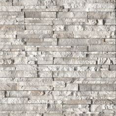 a white brick wall that is made out of stone