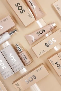 several different types of skin care products are arranged on a table with the words sos