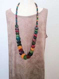 "Multi Colored Long Boho Wood Vintage Necklace. Vintage Wood Bohemian Necklace Long Necklace. Rainbow Wood Vintage Long Wood Necklace Such a pretty piece comprised of Vintage Rainbow Wood and Disc Multi Colored Rainbow Wood Beads. Beautiful Necklace! Necklace is 35 inches long Don't miss out! *If you have have any questions regarding this item, please hit the \"Ask a Question\" button next to the price and I will get back to you within 24 hours:-) We pride ourselves on 100% customer service, ple Bohemian Multicolor Round Beads, Bohemian Multicolor Wooden Beads, Bohemian Wooden Beads Necklaces For Jewelry Making, Unique Multicolor Necklaces For The Beach, Hippie Style Multicolor Long Necklace, Bohemian Multicolor Wooden Bead Necklaces, Bohemian Multicolor Wooden Beads Necklace, Multicolor Bohemian Necklace With Wooden Beads, Artisan Multicolor Handmade Long Necklace