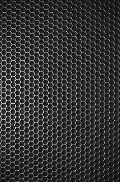 an abstract black and white background with hexagonal grids in the center, as well as circles