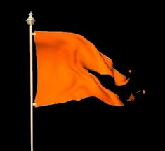 an orange flag flying in the wind on top of a white pole with a black background