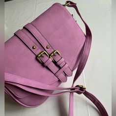 This Merona Crossbody Purse Handbag In A Beautiful Shade Of Purple Is Perfect For Any Occasion. With A Rectangular Shape And Snap Closure, It Features A Medium Size With A Bag Width Of 11 Inches, A Bag Height Of 7 Inches, And A Bag Depth Of 3 Inches. The Crossbody Strap Is Adjustable And Made Of Faux Leather, As Well As The Handle/Strap Color Is Also Purple. Inside Has An Open Pocket Along The Front Which Is Perfect For A Phone. Inside Has A Zipper Pocket And 2 Slip Pockets. Snap Closure On The Purple Satchel Bag With Adjustable Strap, Purple Crossbody Bag With Adjustable Handle, Chic Purple Satchel With Adjustable Strap, Purple Satchel Shoulder Bag With Adjustable Strap, Chic Purple Crossbody Bag, Chic Purple Bag With Adjustable Strap, Purple Crossbody Bag With Adjustable Strap, Chic Purple Shoulder Bag With Adjustable Strap, Purple Crossbody Satchel With Adjustable Strap