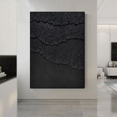 a black and white abstract painting in a living room