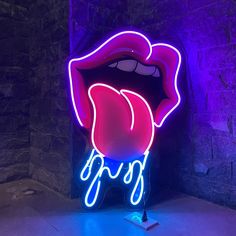 a neon sign that says lips on it